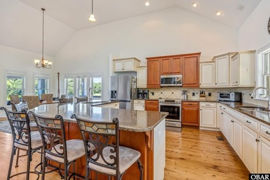 Tucked inside the gates of The Currituck Club, this six-bedroom - photo 4