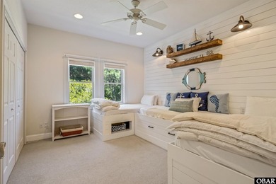 Tucked inside the gates of The Currituck Club, this six-bedroom - photo 8