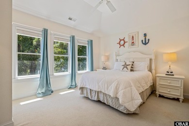 Tucked inside the gates of The Currituck Club, this six-bedroom - photo 9