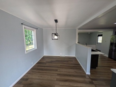 This charming split-level home, built in 1960, offers a perfect - photo 16