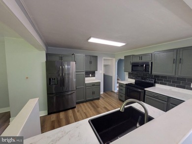 This charming split-level home, built in 1960, offers a perfect - photo 18