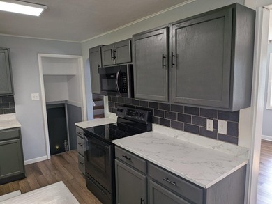 This charming split-level home, built in 1960, offers a perfect - photo 20