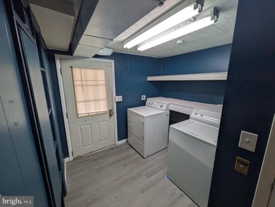 This charming split-level home, built in 1960, offers a perfect - photo 35