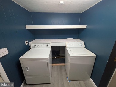 This charming split-level home, built in 1960, offers a perfect - photo 36