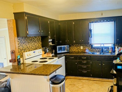 Take a look at this inviting 4-bedroom, 2-bathroom home tucked - photo 6