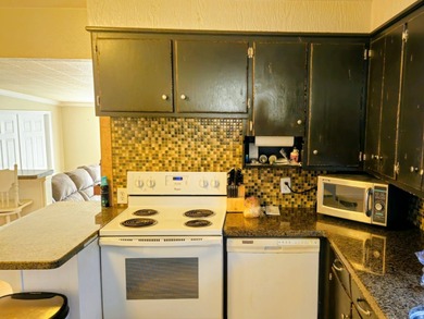 Take a look at this inviting 4-bedroom, 2-bathroom home tucked - photo 7