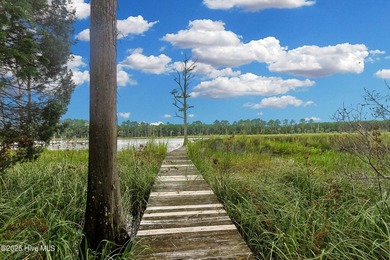 Waterfront homesite with extensive dock frontage in the gated - photo 5
