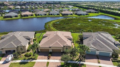 Set on a unique lot with stunning lakefront and preserve views - photo 3