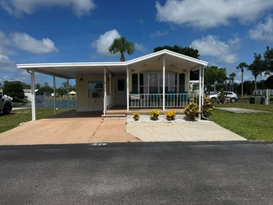 PARADISE AT YOUR FINGERTIPS! This AFFORDABLE home is in the LOW - photo 1