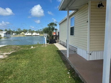 PARADISE AT YOUR FINGERTIPS! This AFFORDABLE home is in the LOW - photo 2