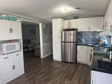 PARADISE AT YOUR FINGERTIPS! This AFFORDABLE home is in the LOW - photo 10