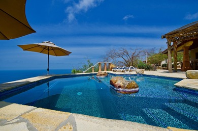 Perched on a dramatic bluff above the Pacific Ocean, MARALUZ is - photo 34