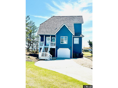This gem of a home located in the Village at Nags Head is a - photo 1