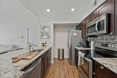 Welcome to this charming two-bedroom, one-bathroom condominium - photo 1