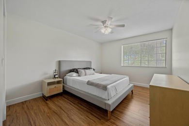 Welcome to this charming two-bedroom, one-bathroom condominium - photo 7