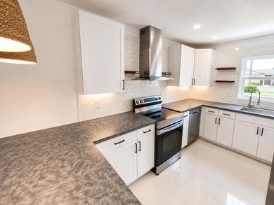 Welcome home to this beautifully upgraded villa in a peaceful - photo 2