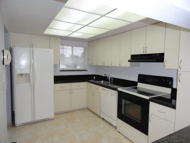 BRIGHT AND SPACIOUS second floor condo, tiled throughout - photo 3