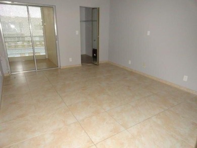 BRIGHT AND SPACIOUS second floor condo, tiled throughout - photo 5