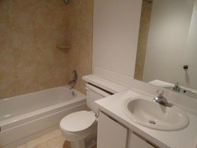 BRIGHT AND SPACIOUS second floor condo, tiled throughout - photo 6