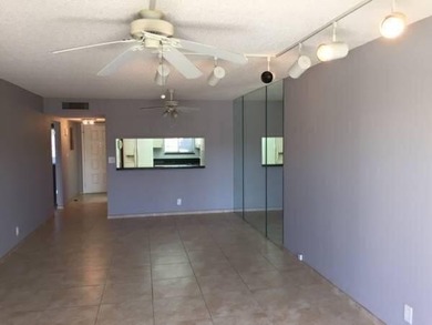 BRIGHT AND SPACIOUS second floor condo, tiled throughout - photo 7