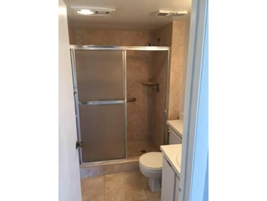 BRIGHT AND SPACIOUS second floor condo, tiled throughout - photo 9