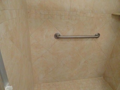 BRIGHT AND SPACIOUS second floor condo, tiled throughout - photo 10