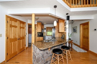 Stunning lake views immediately capture your attention upon - photo 19