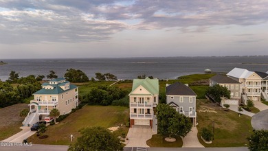 Waterfront Grandeur meets Modern Masterpiece. Positioned on the - photo 20
