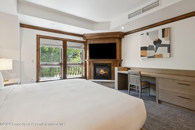 The Aspen Mountain Residences is nestled at the base of the - photo 13