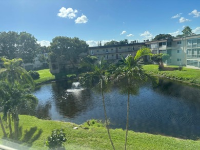 Lake Condo For Sale in Palm Springs, Florida