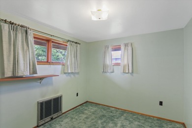 Situated on a corner lot in the sought-after Garland District