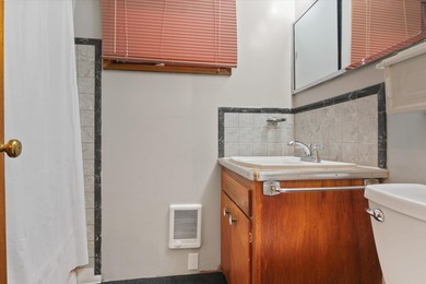 Situated on a corner lot in the sought-after Garland District