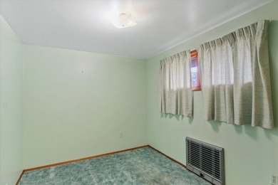 Situated on a corner lot in the sought-after Garland District