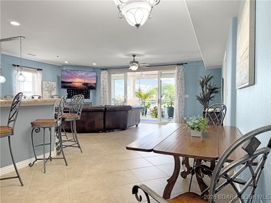 Welcome to Majestic Pointe Unit 1A, a rare end-unit in a gated