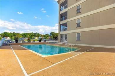 Welcome to Majestic Pointe Unit 1A, a rare end-unit in a gated