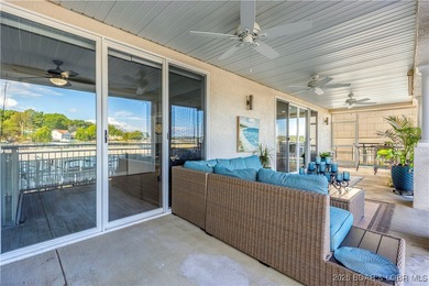 Welcome to Majestic Pointe Unit 1A, a rare end-unit in a gated