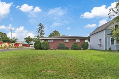 Situated on a corner lot in the sought-after Garland District