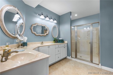 Welcome to Majestic Pointe Unit 1A, a rare end-unit in a gated