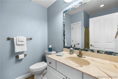 Welcome to Majestic Pointe Unit 1A, a rare end-unit in a gated