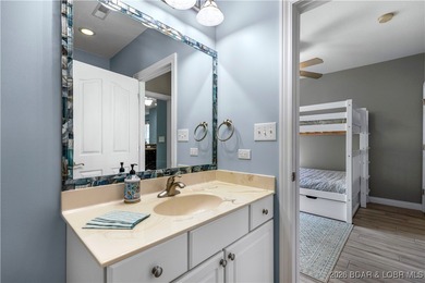 Welcome to Majestic Pointe Unit 1A, a rare end-unit in a gated