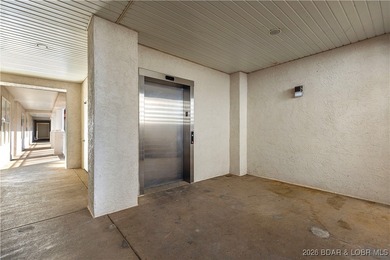 Welcome to Majestic Pointe Unit 1A, a rare end-unit in a gated