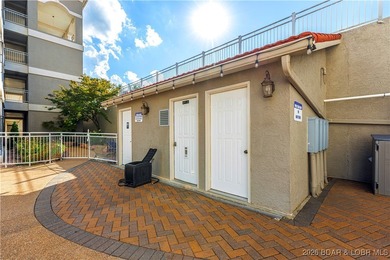 Welcome to Majestic Pointe Unit 1A, a rare end-unit in a gated