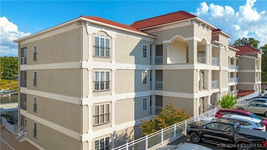 Welcome to Majestic Pointe Unit 1A, a rare end-unit in a gated