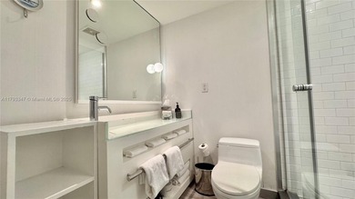 High-floor furnished studio with wide bay views. Part of the