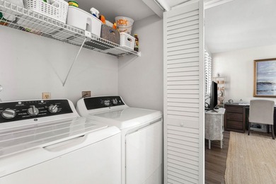 Positioned mere steps from the shoreline, this three-bedroom - photo 15
