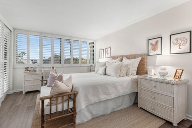 Positioned mere steps from the shoreline, this three-bedroom - photo 16