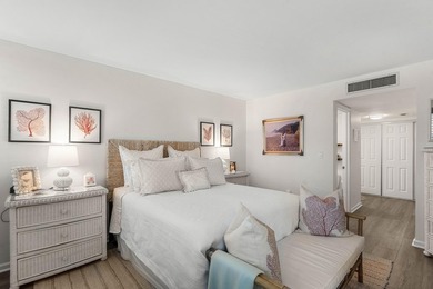 Positioned mere steps from the shoreline, this three-bedroom - photo 17