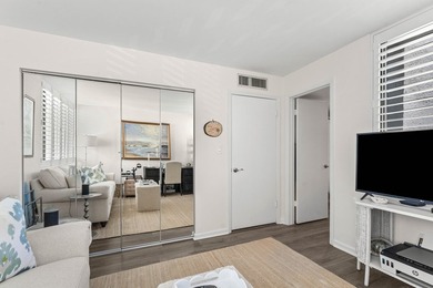 Positioned mere steps from the shoreline, this three-bedroom - photo 25