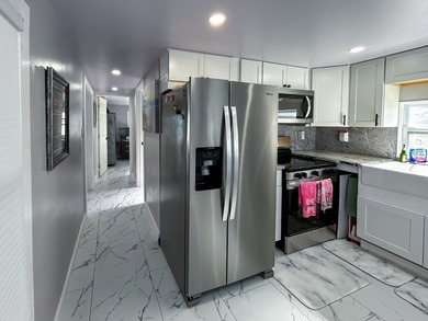 This glamorous waterfront home has been completely reimagined - photo 12