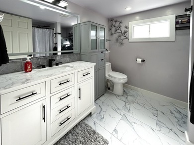 This glamorous waterfront home has been completely reimagined - photo 21